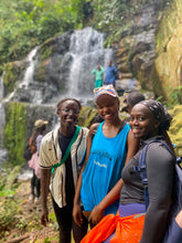 Load image into Gallery viewer, Group of hikers standing at the lakeside on the Mukono Sunny Day Epic adventure
